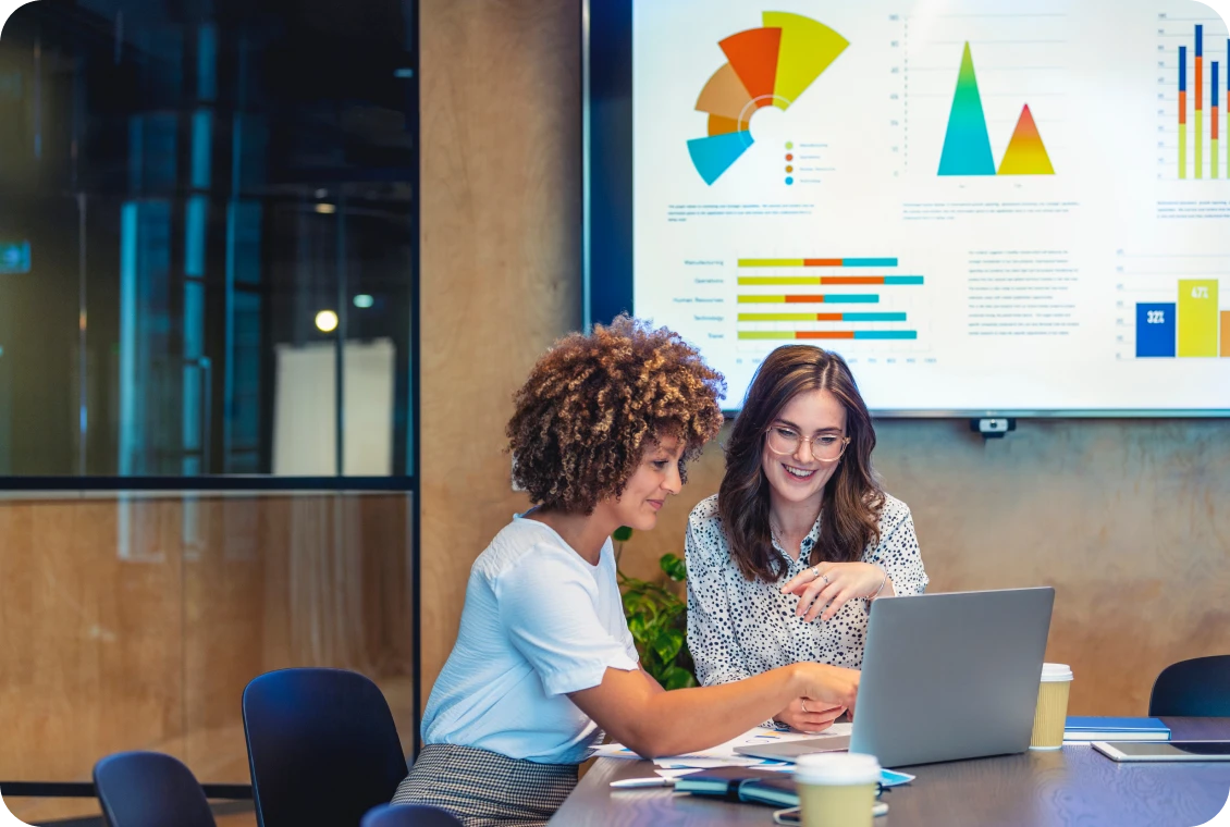 Business meeting with charts displayed