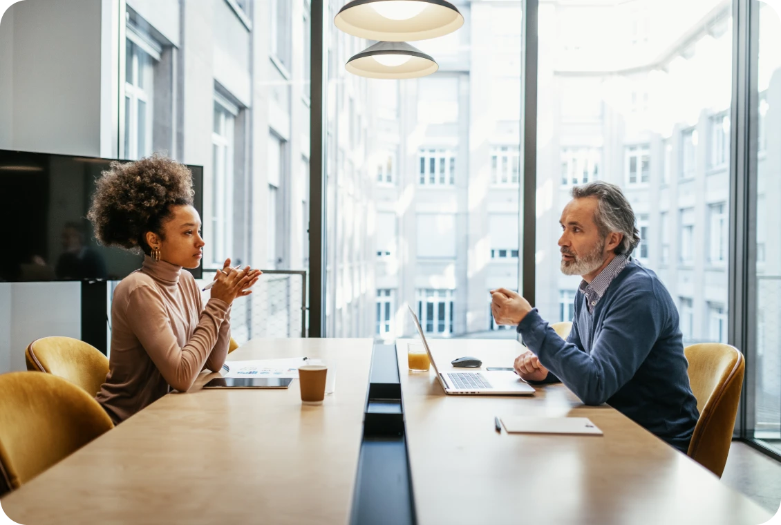 Colleagues discussing at a conference table